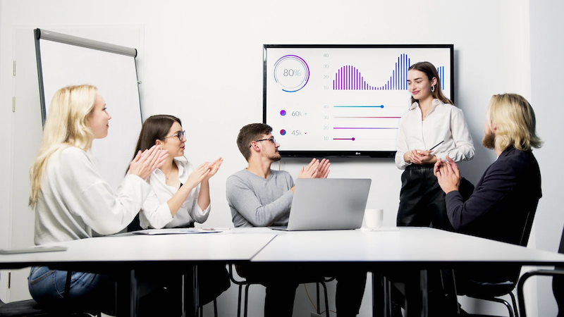 A Group of People Clapping to Presenting a Graph-800p